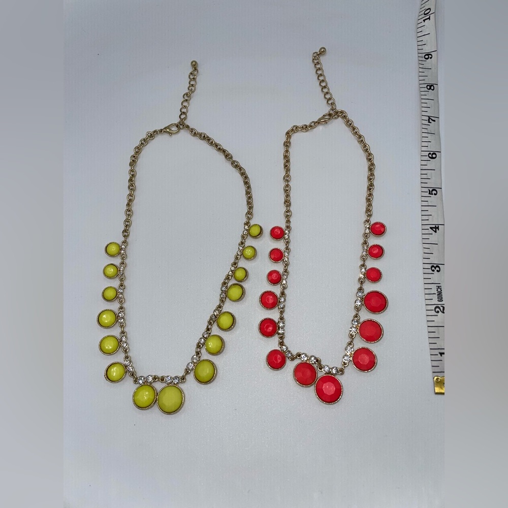 Two necklaces, one Neon Green and the other Coral
